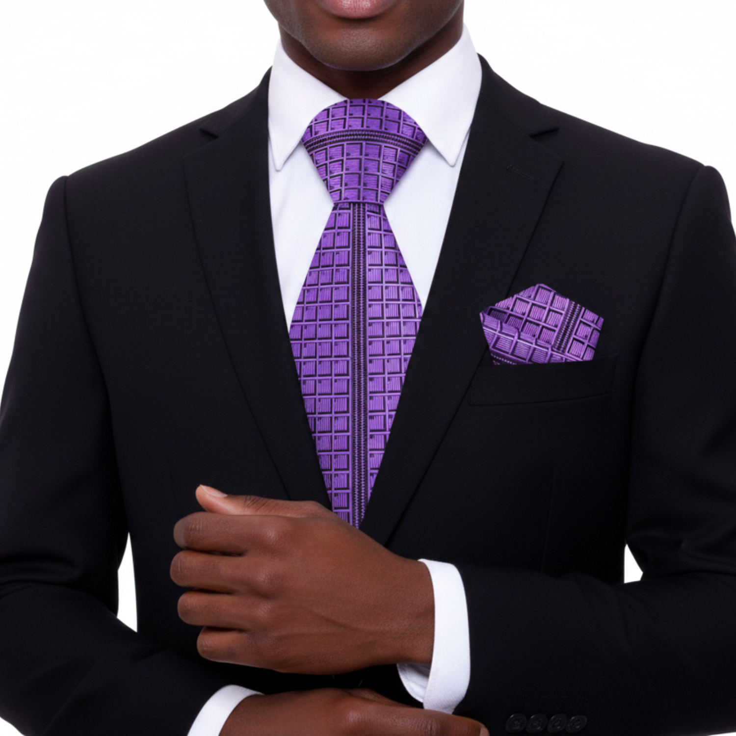 Man wearing a black suit with a purple tie and pocket square on a white background