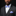 Man wearing a black suit with a purple bow tie and pocket square on a black background