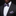 Man wearing a black suit with a white shirt, purple bow tie, and stripe pocket square.