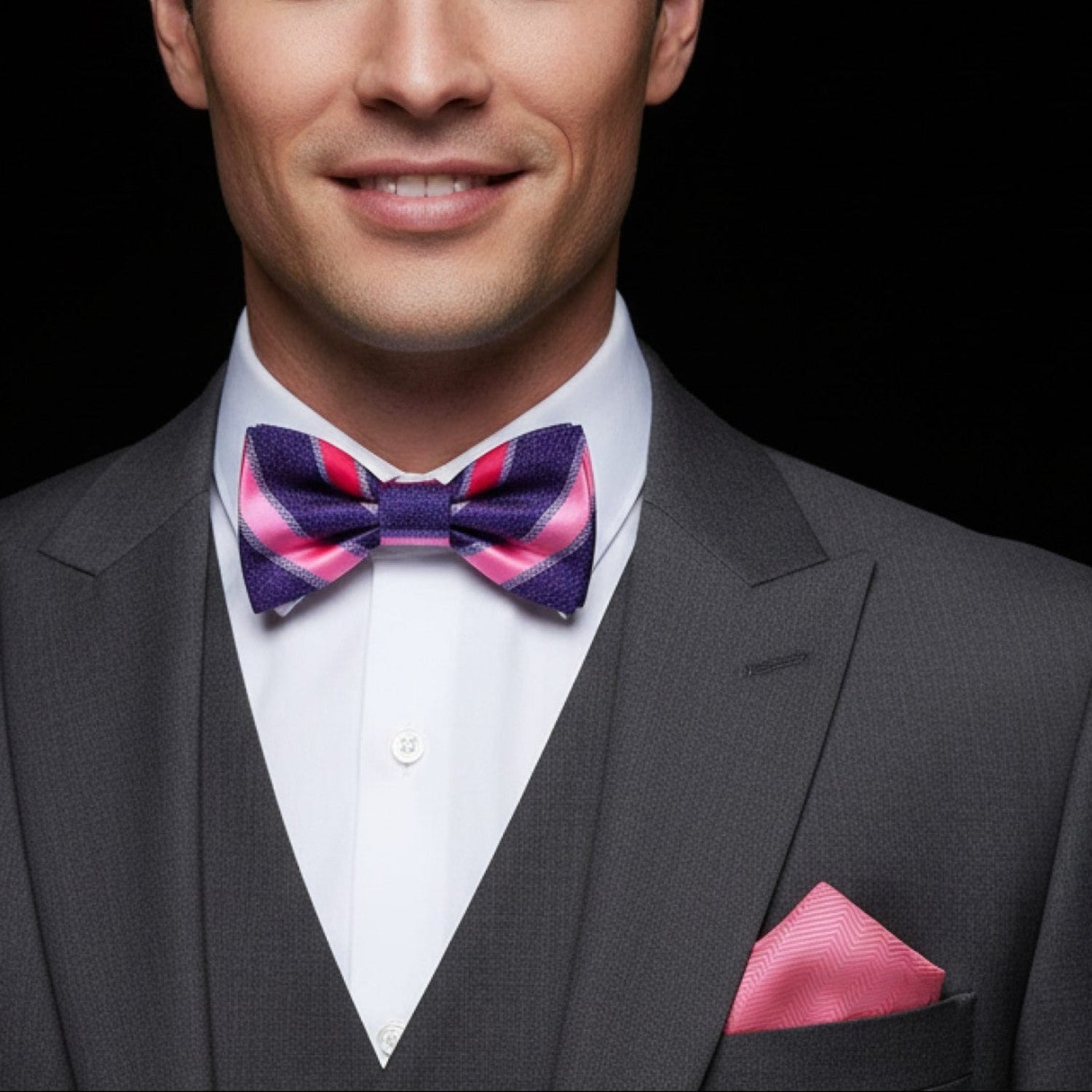 Stripe purple and pink bow tie and pink pocket square on man