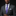 Man wearing a gray suit with a purple plaid tie against a black background
