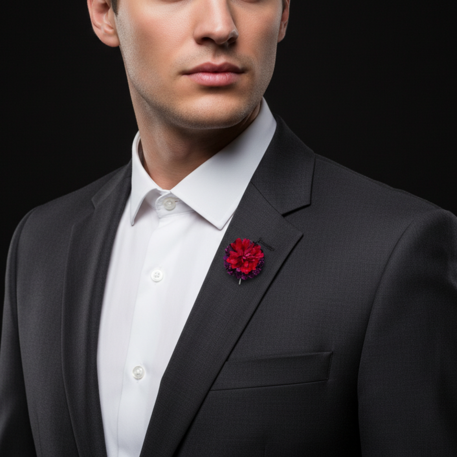 Red and purple flower-shaped lapel pin on man with suit