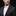 Red and purple flower-shaped lapel pin on man with suit