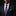 Man wearing a black suit with a purple tie and pocket square on a dark background