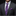 Man wearing a gray suit with a purple paisley tie and pocket square.