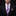 Man wearing a black suit with a purple striped tie and matching pocket square on a black background