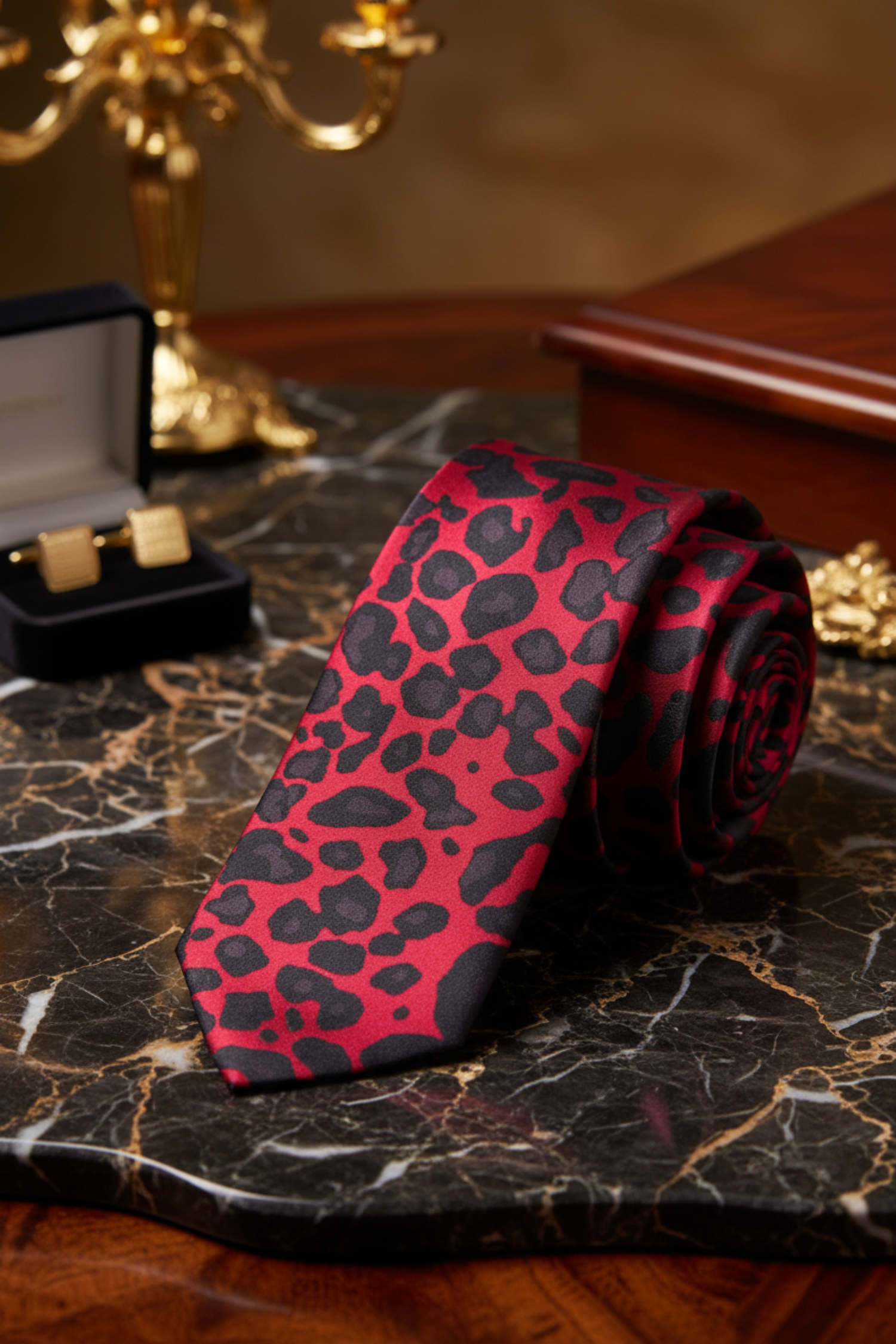 A necktie with a vibrant pink and black leopard print pattern 