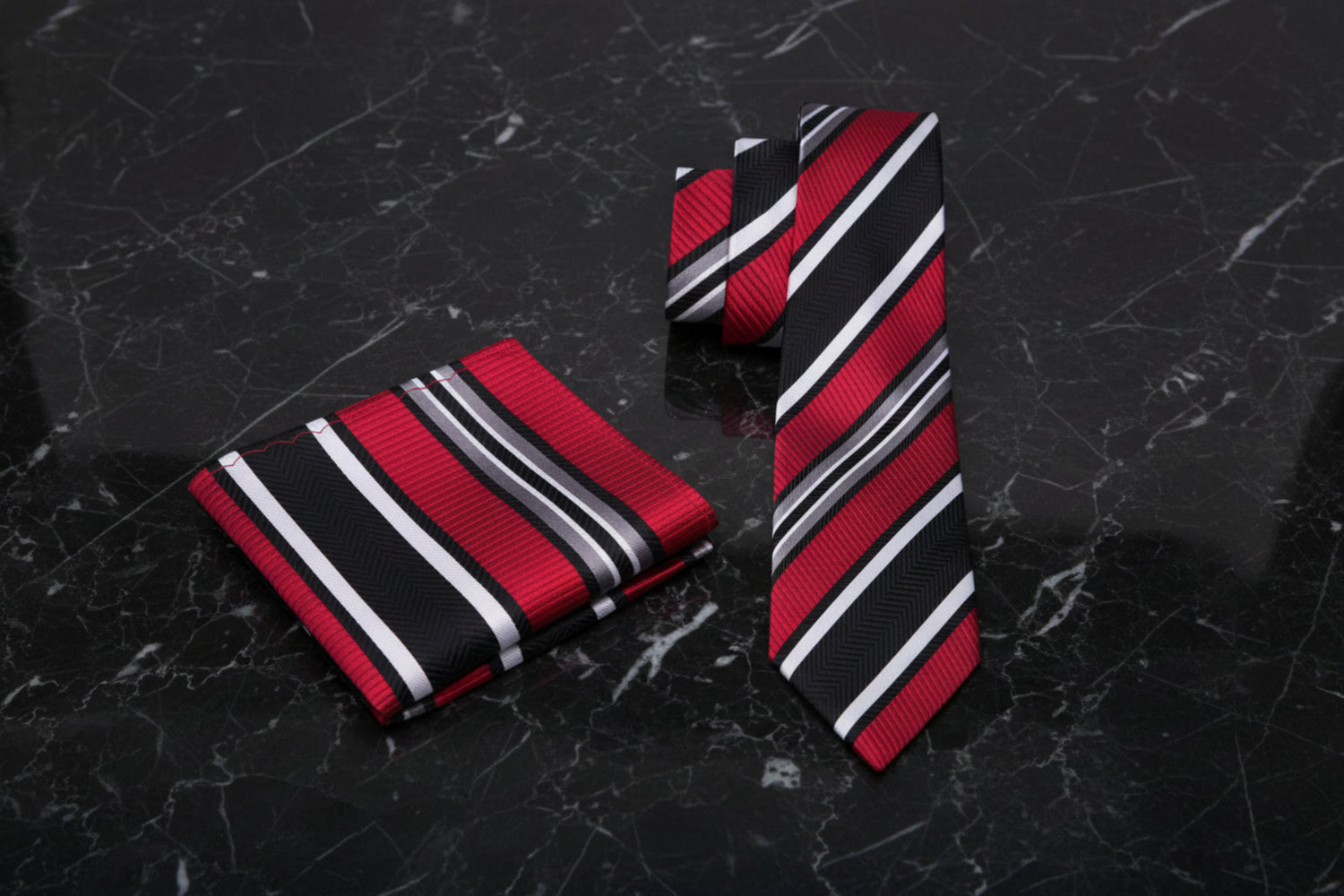 Red, black, and white striped thin tie and pocket square set 