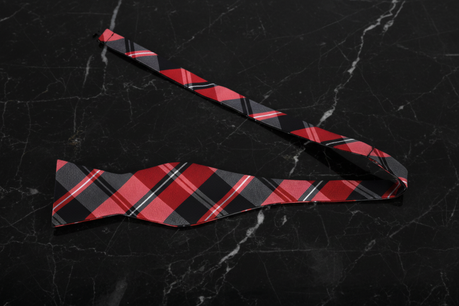A Red, Black Plaid Pattern Self Tie Bow Tie