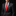 Man wearing a black suit with a red tie and pocket square on a black background