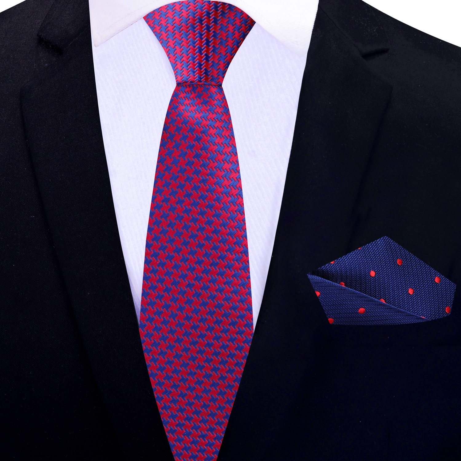Red and blue patterned thin tie and pocket square on a black suit jacket.