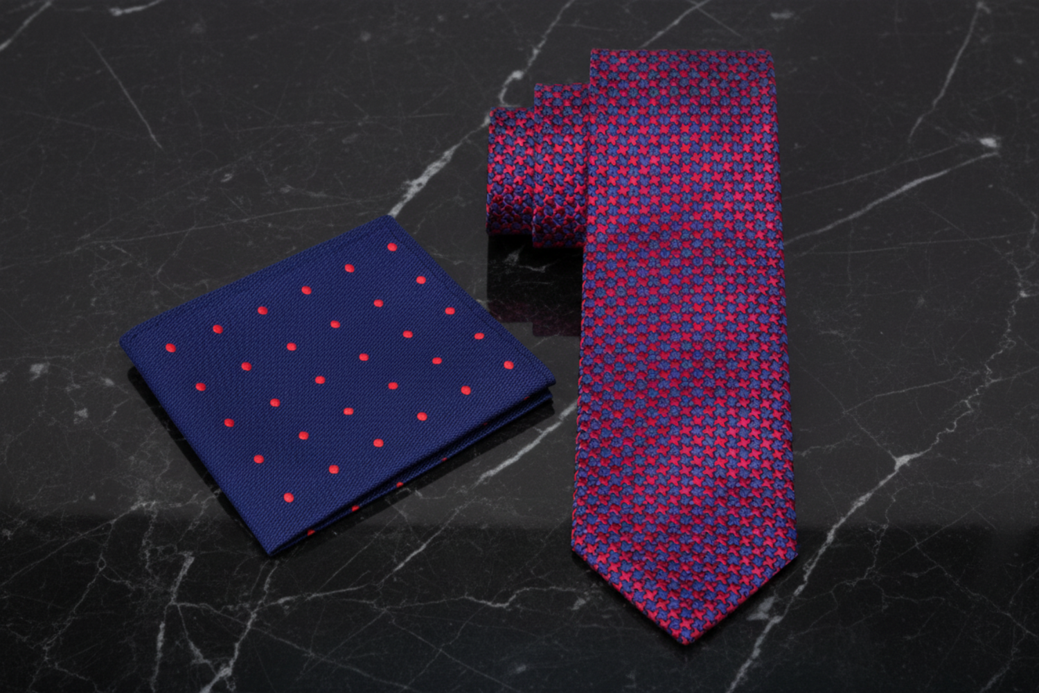 Blue pocket square with red polka dots and a red and blue patterned tie 