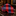 A rolled necktie with a red and navy blue check pattern, displayed on a polished black marble surface with a blurred luxury interior background.