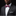 Man wearing a black suit with a white shirt and red bow tie on a black background