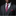 Man wearing a gray suit with a red patterned tie and pocket square against a black background