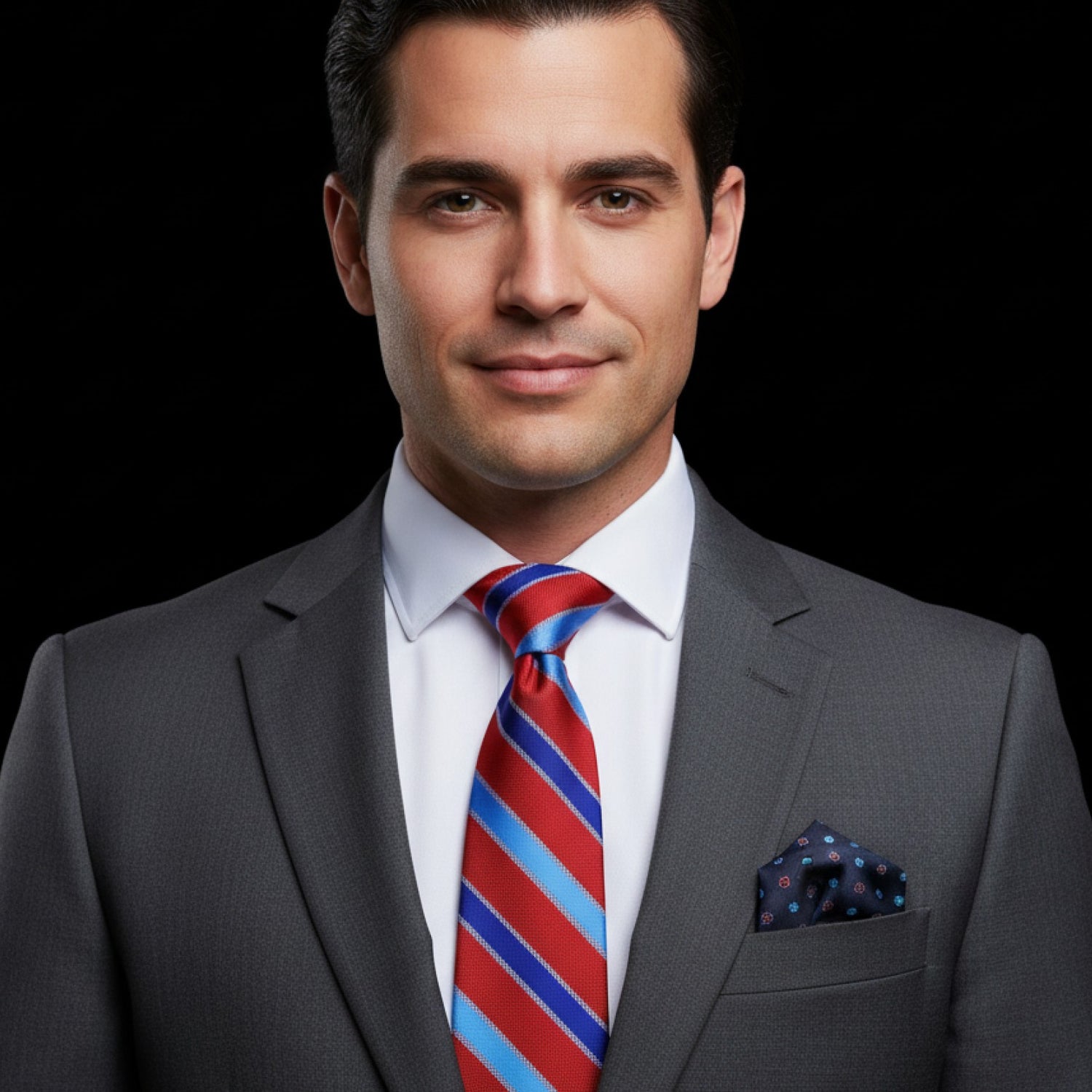 Man wearing red and blue stripe tie with accenting blue floral square