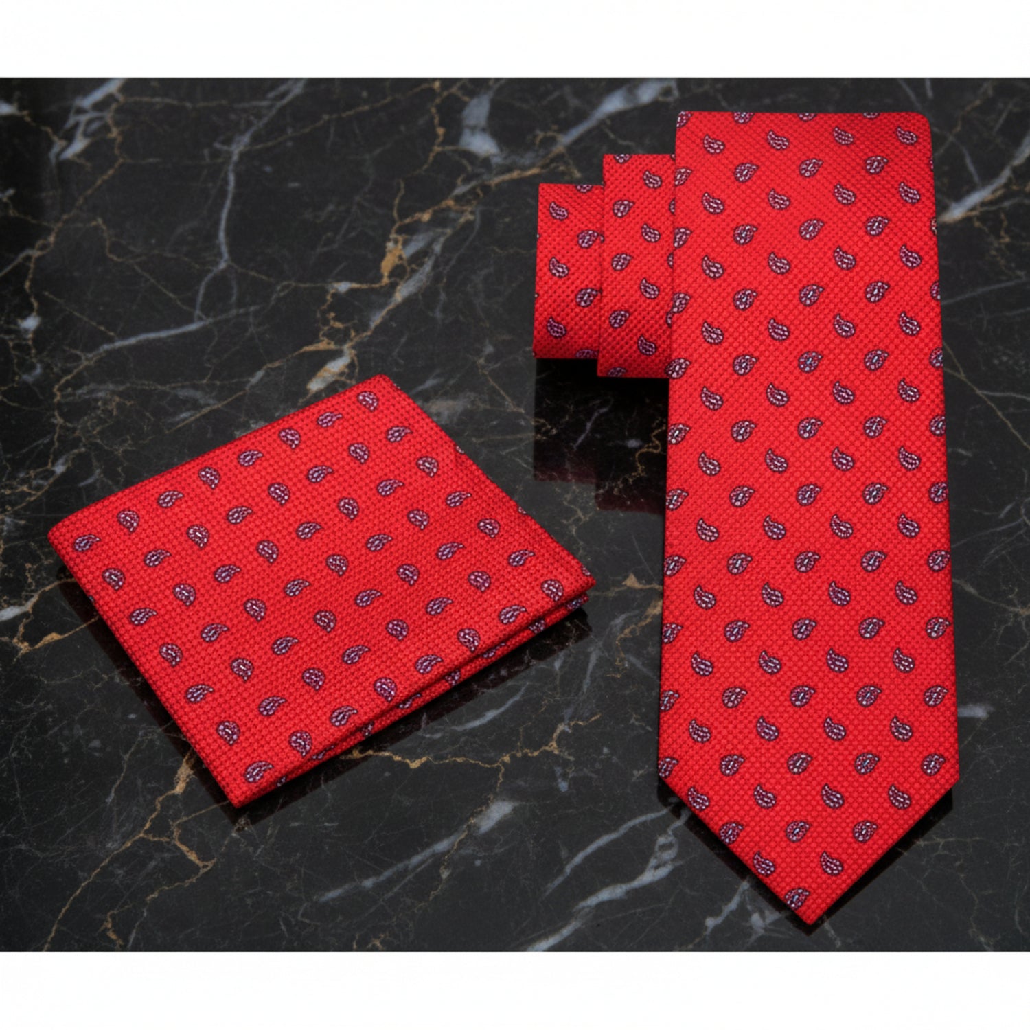 Red tie and matching pocket square on a white background