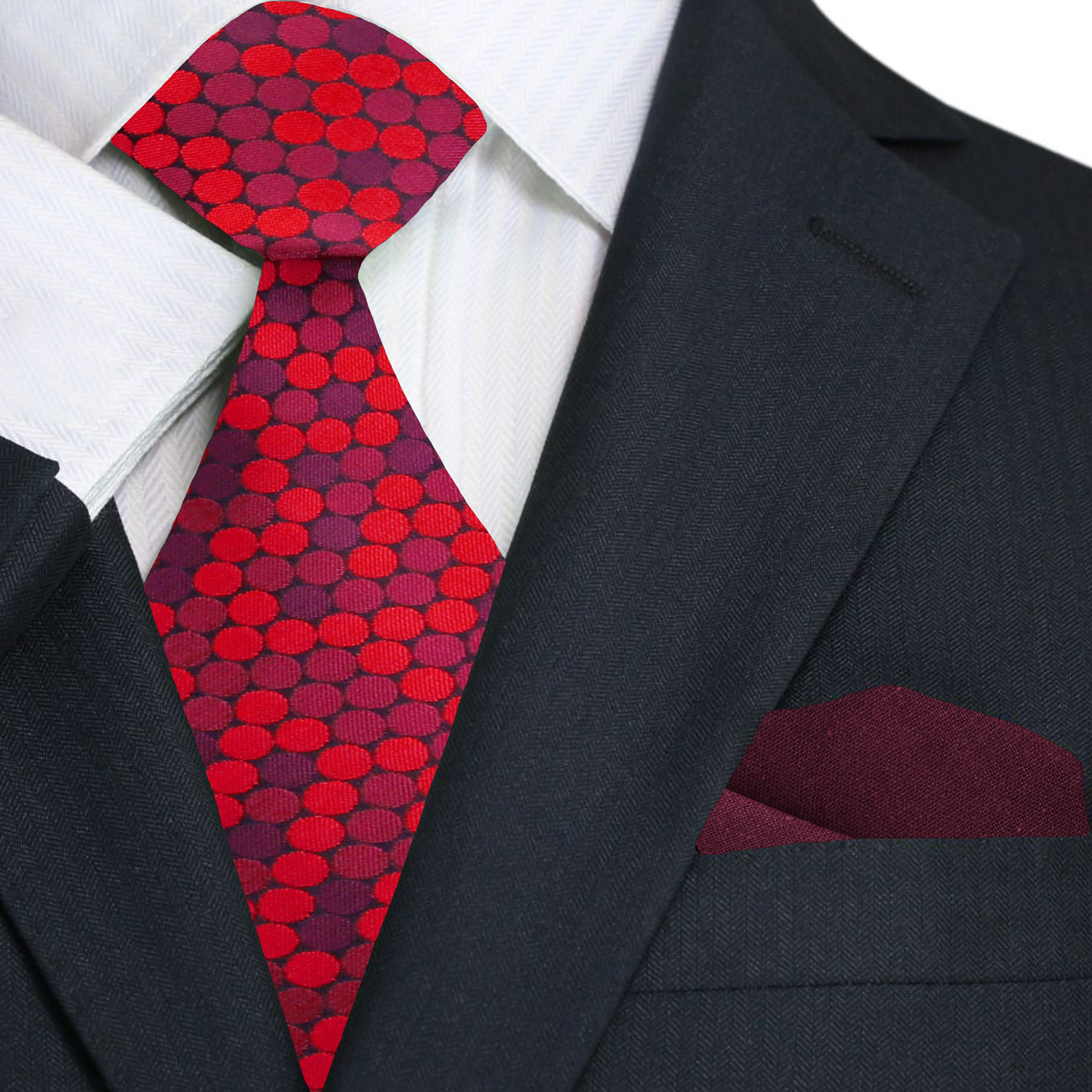 Red and purple polka dot tie with red pocket square on a black suit.