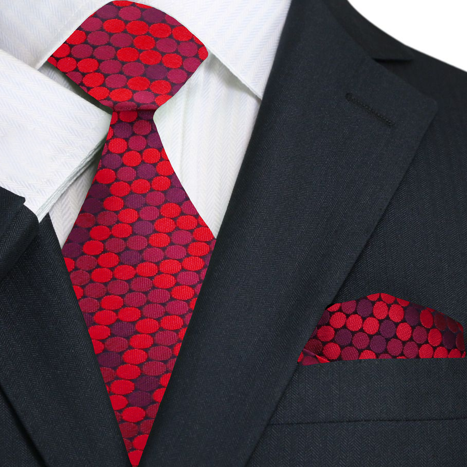 Red polka dot tie and pocket square with a black suit jacket.