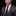 Man wearing a gray suit with a red tie and pocket square on a black background