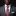 Man wearing a gray suit with a white shirt and a red patterned tie against a black background