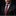 Man wearing a dark suit with a red tie and pocket square against a black background