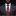 Man wearing a gray suit with a red paisley tie and pocket square on a black background
