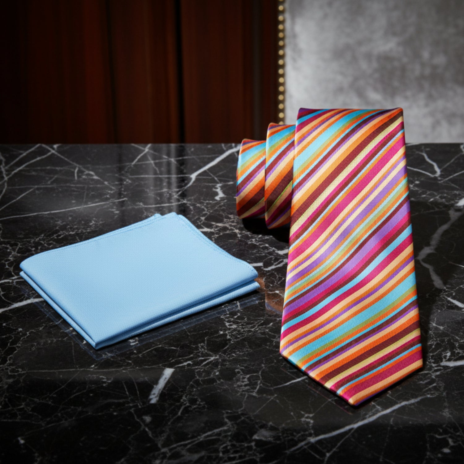 Colorful striped tie and light blue pocket square 