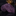 Roll of purple glittery fabric on a reflective surface with blurred background