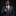 Man adjusting his tie in a gray suit with a black background