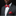 Man wearing a gray suit with a red polka dot bow tie and pocket square against a black background
