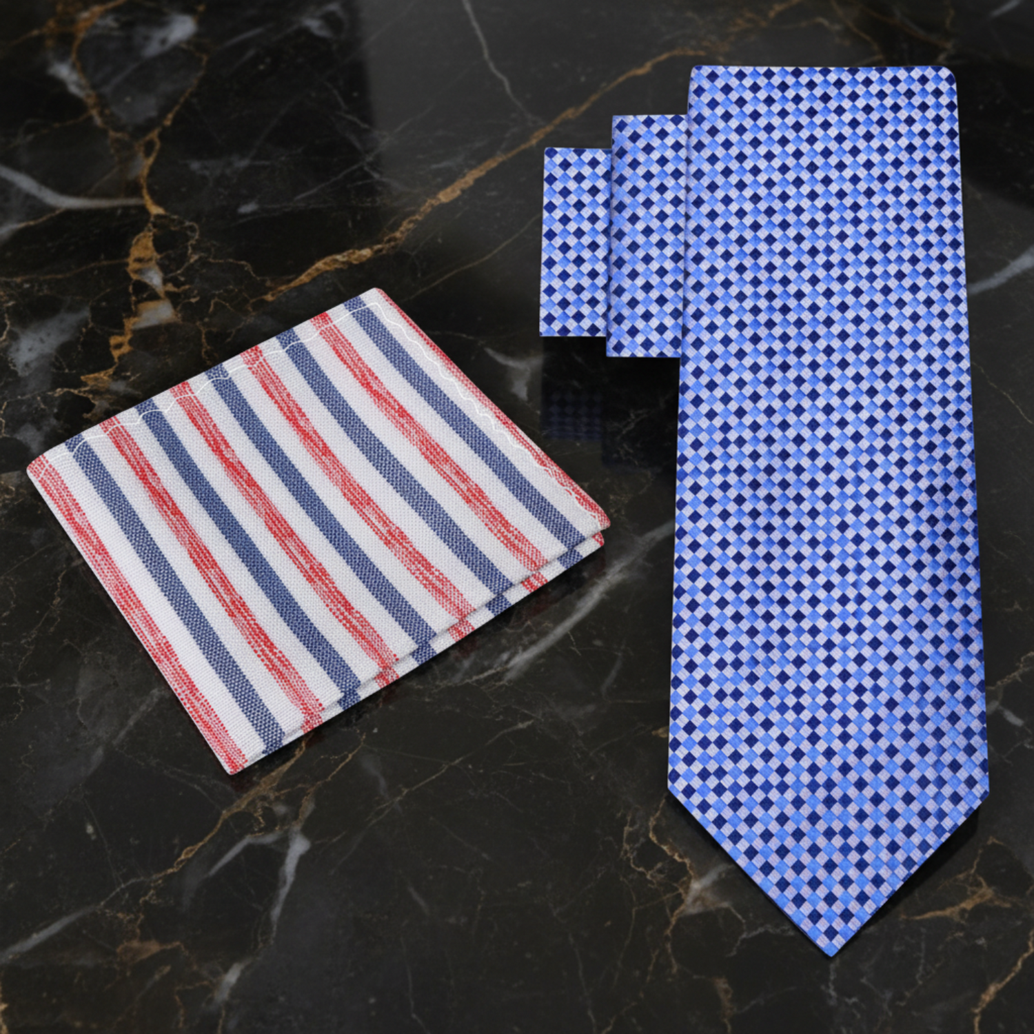 Set of patterned ties and pocket square on a white background