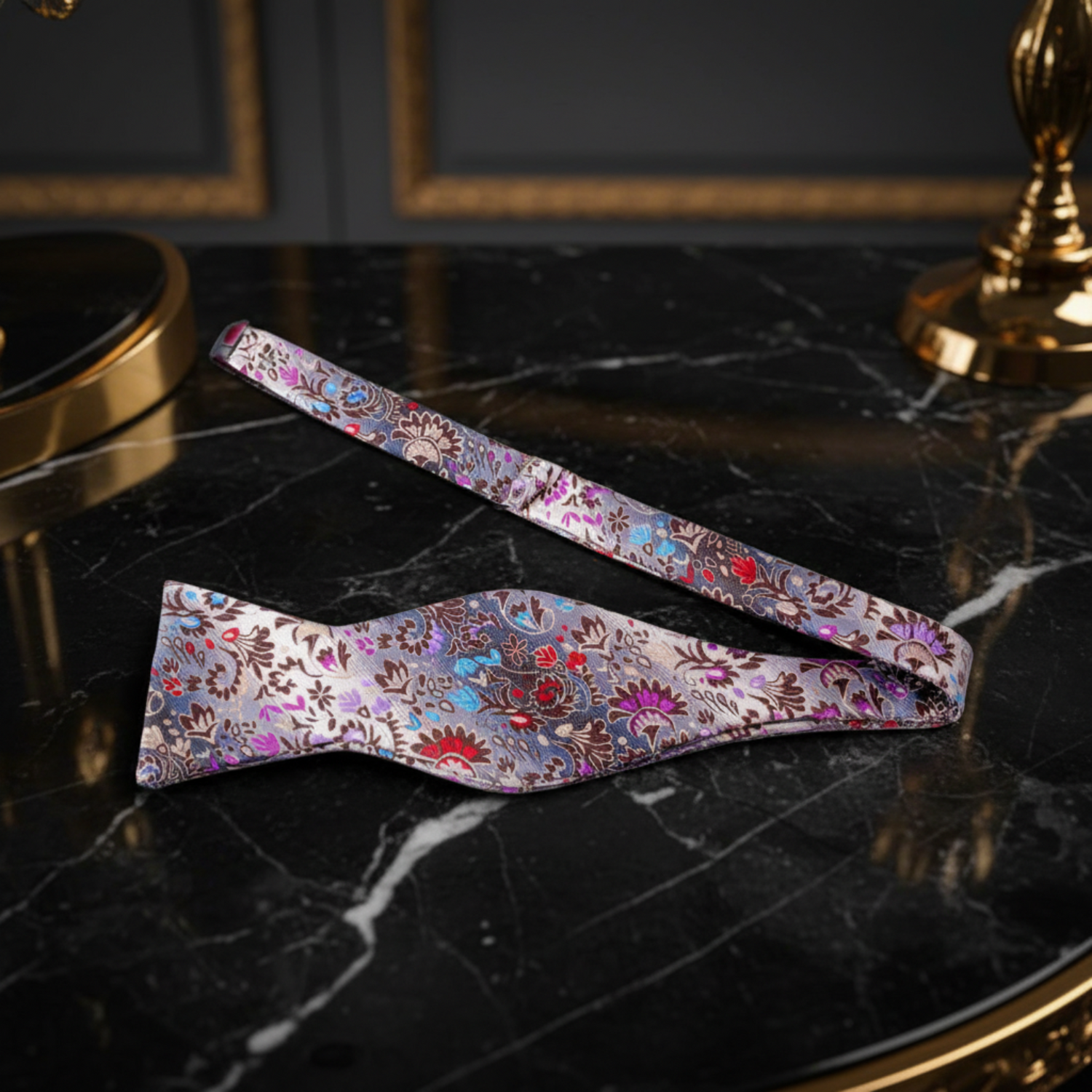 A self tie bow tie with floral pattern and blue red flowers