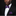Man wearing a black suit with a white shirt and purple bow tie and pocket square against a black background