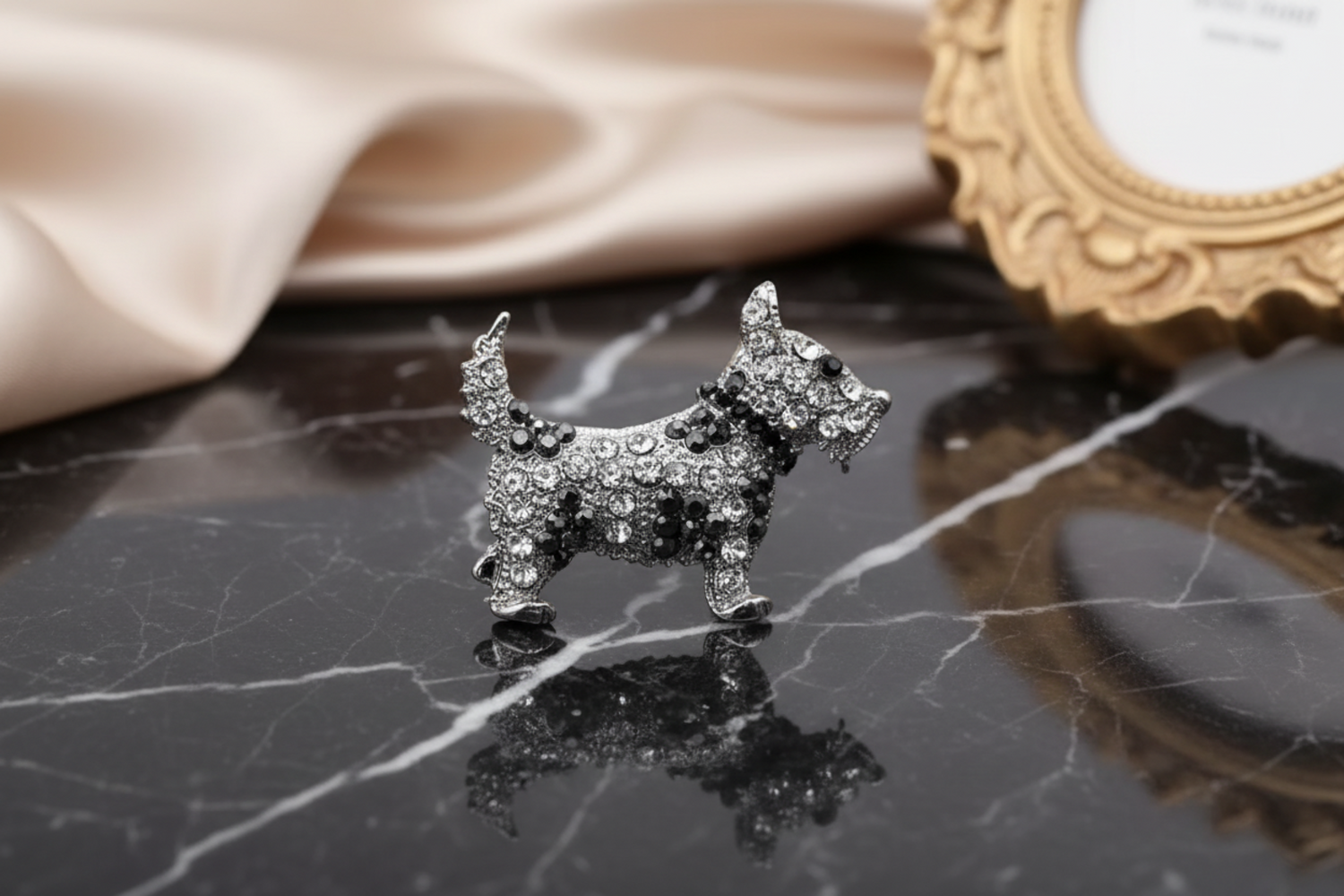 Diamante dog brooch on a white background