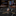 Star-shaped premium lapel pin with red, blue, and gold colors 