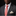 Man wearing a gray suit with a pink tie and white shirt against a black background