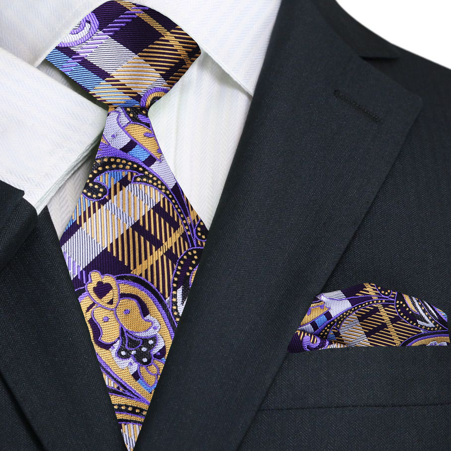 Black suit with a patterned purple and gold paisley and plaid tie and pocket square
