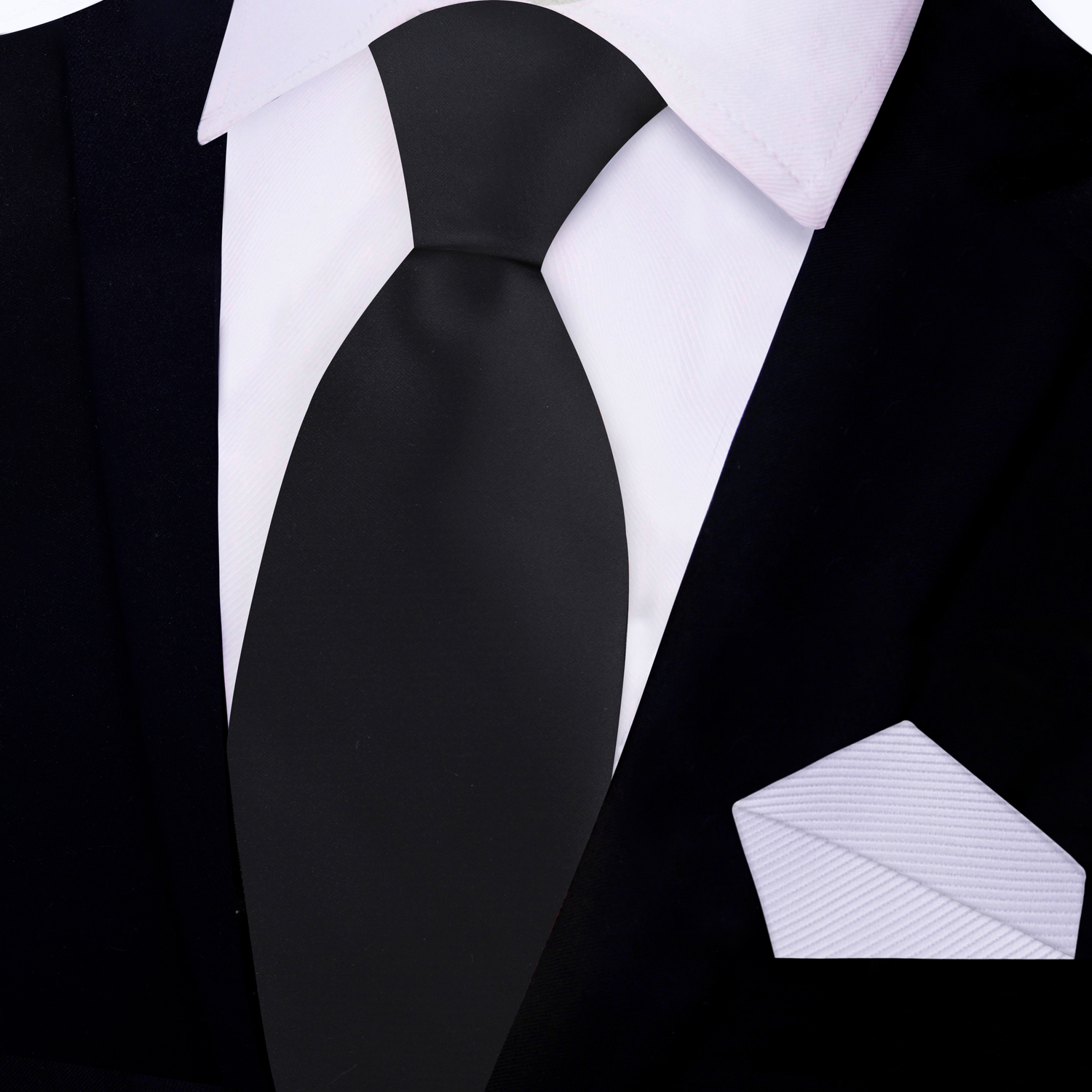 Black tie and pocket square on a white shirt with black jacket