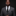 Man wearing a gray suit with a black tie against a dark background