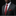 Man wearing a gray suit with a red tie and pocket square on a black background