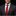 Man wearing a black suit with a red tie and pocket square on a dark background