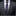 Gray suit with a blue patterned tie and pocket square on a black background