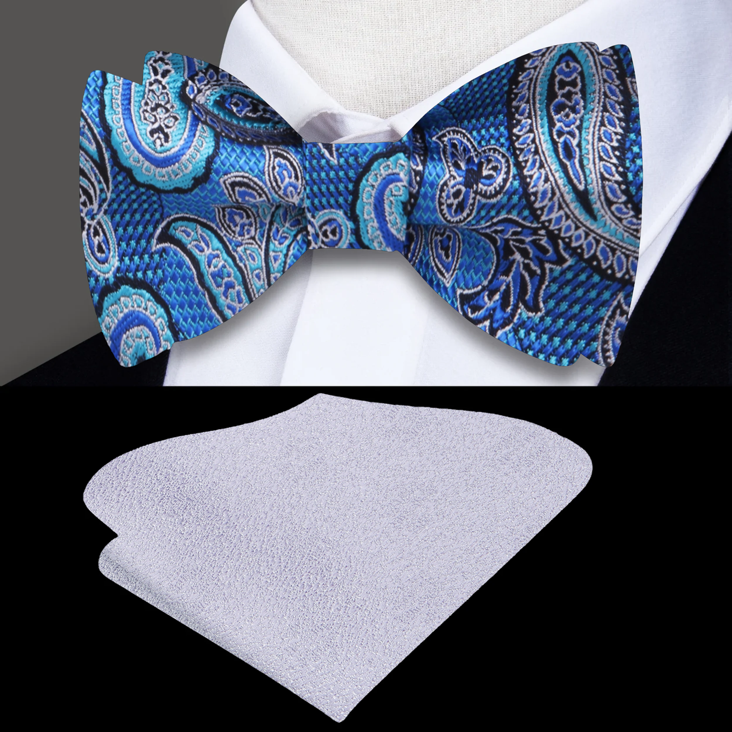 Blue paisley bow tie and silver pocket square on a black background