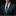 Man wearing a black suit with a blue and black patterned tie and pocket square on a dark background