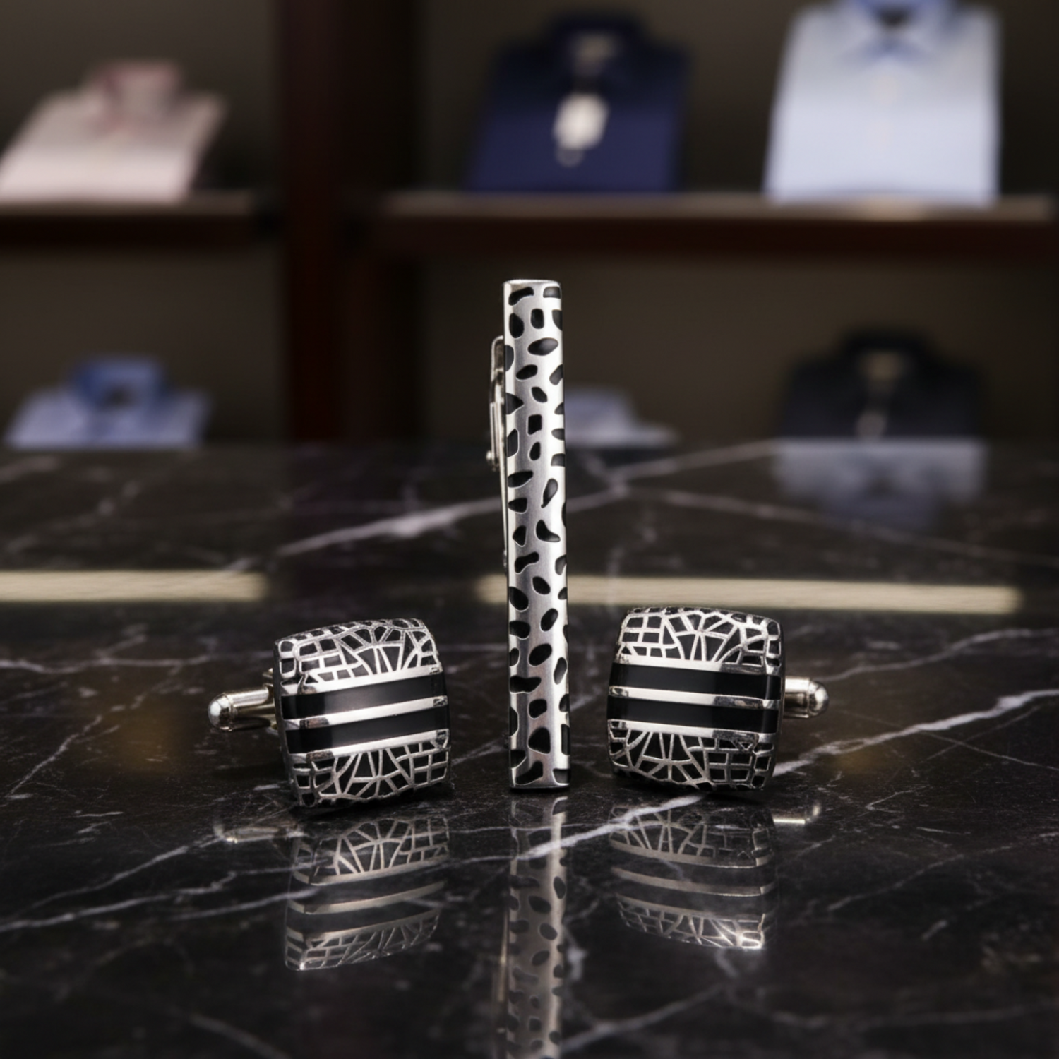 a tie clip and cufflinks