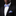 Man wearing a black suit with a colorful floral bow tie and pocket square on a black background