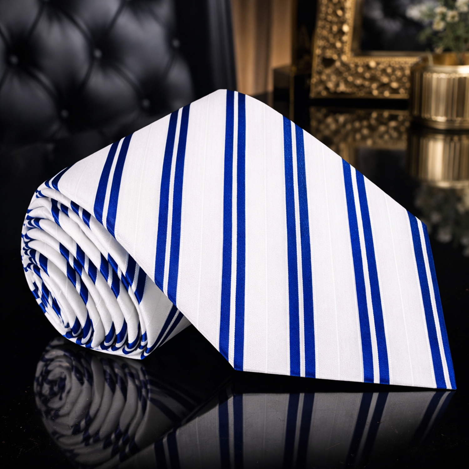 White tie with blue stripes on a reflective surface