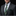 Man wearing a gray suit with a green patterned tie and accenting pocket square on a black background