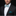 Man wearing white and green lucky bow tie and square on suit